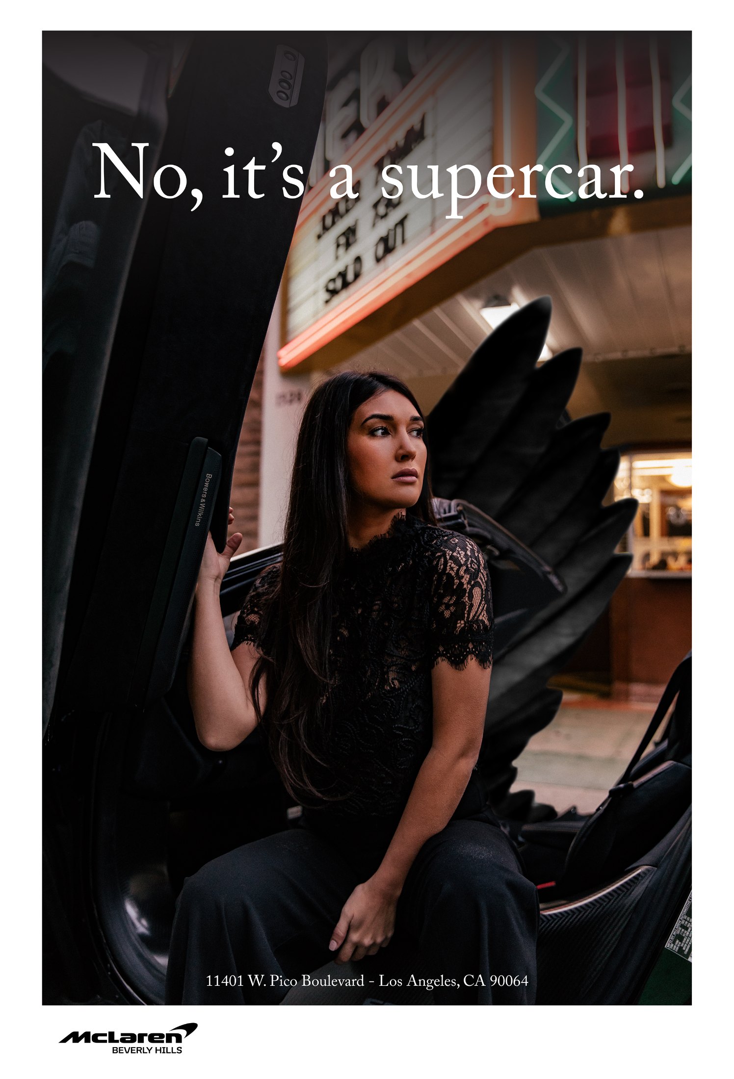 McLaren 600LT – poster No, it’s a supercar: woman in black lace in the open butterfly door under a cinema marquee neon, McLaren Beverly Hills, photo Jon Filin