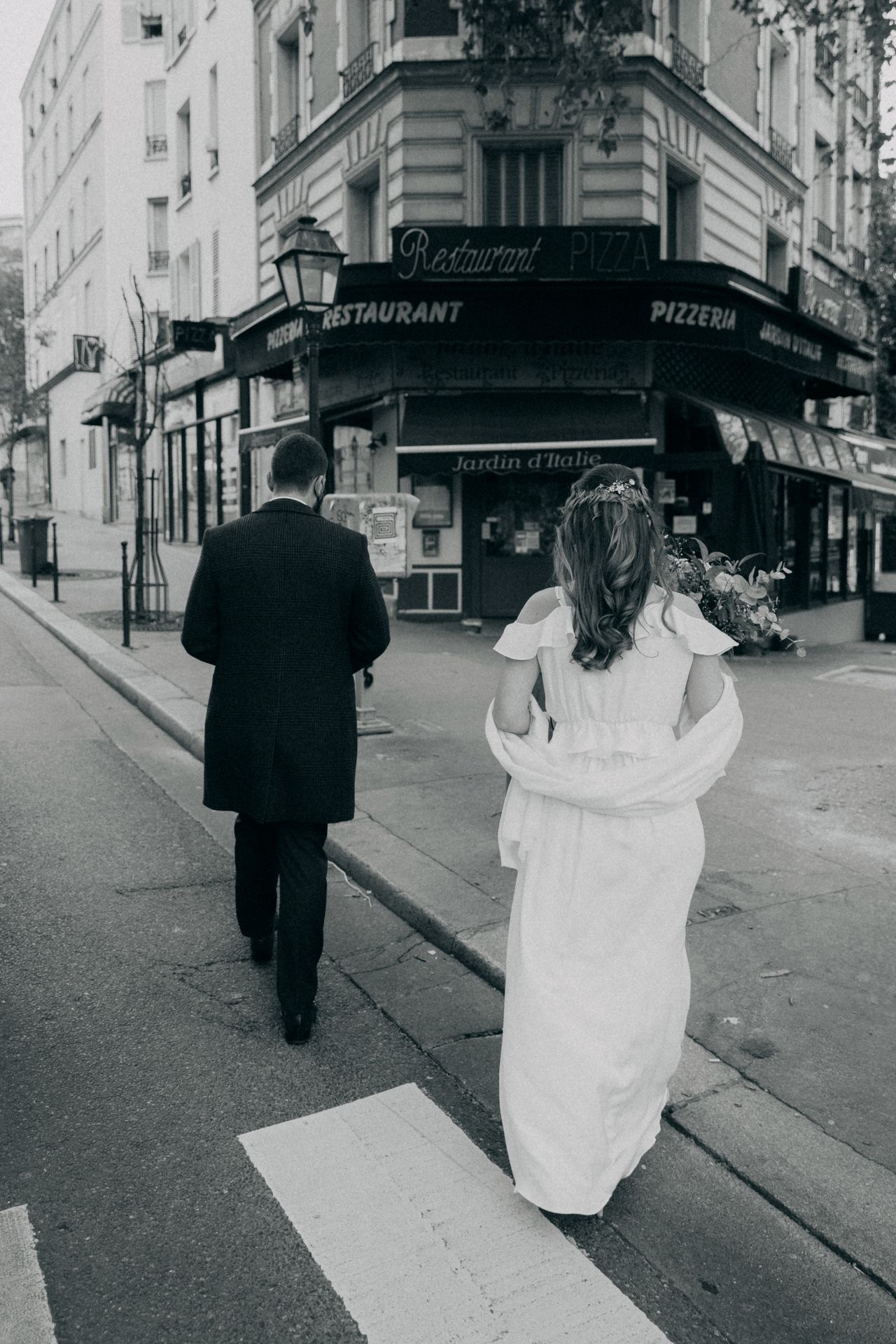 Film wedding photography in Paris, France — bride and groom walking